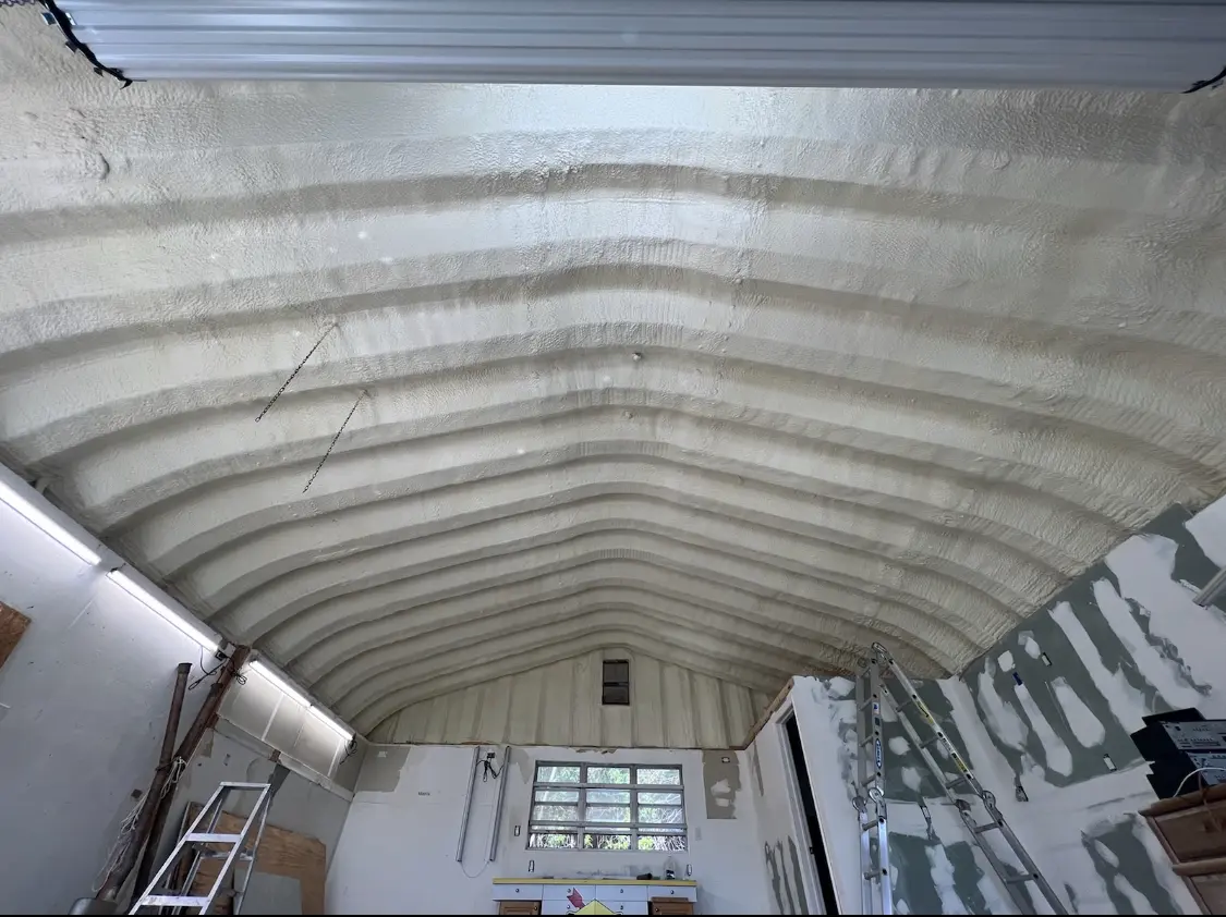 Spray polyurethane foam applied to the underside of a metal roof deck in Hope Mills